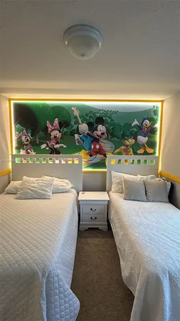 a bed room with a bed and a large window