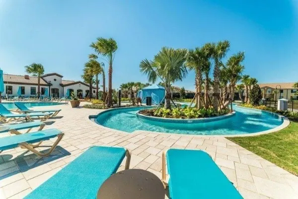 a view of a swimming pool with a yard