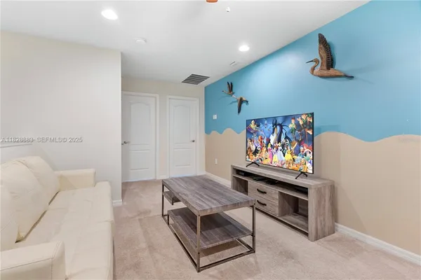 a living room with furniture and a table