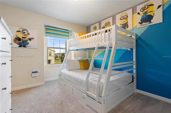 a bedroom with bed and window
