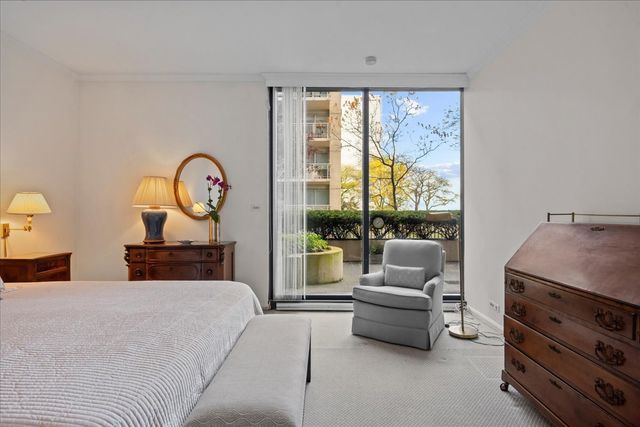 a bathroom with a granite countertop sink mirror and shower