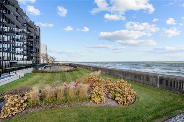 a view of balcony with wooden floor and outdoor seating