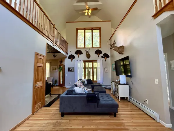 a living room with furniture or couch and a dining table