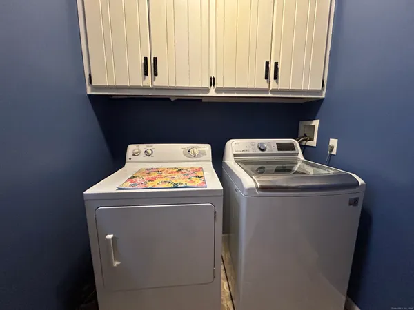 a utility room with washer and dryer
