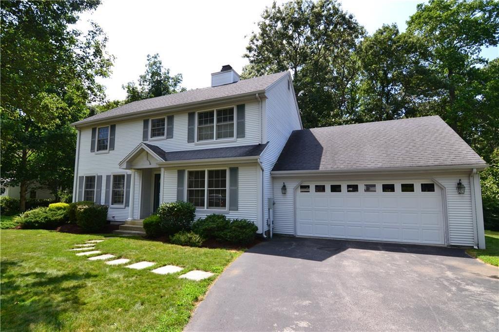 49 Payer Lane Groton, CT 06355 - Photo 1 of 1 a front view of a house with a yard and garage