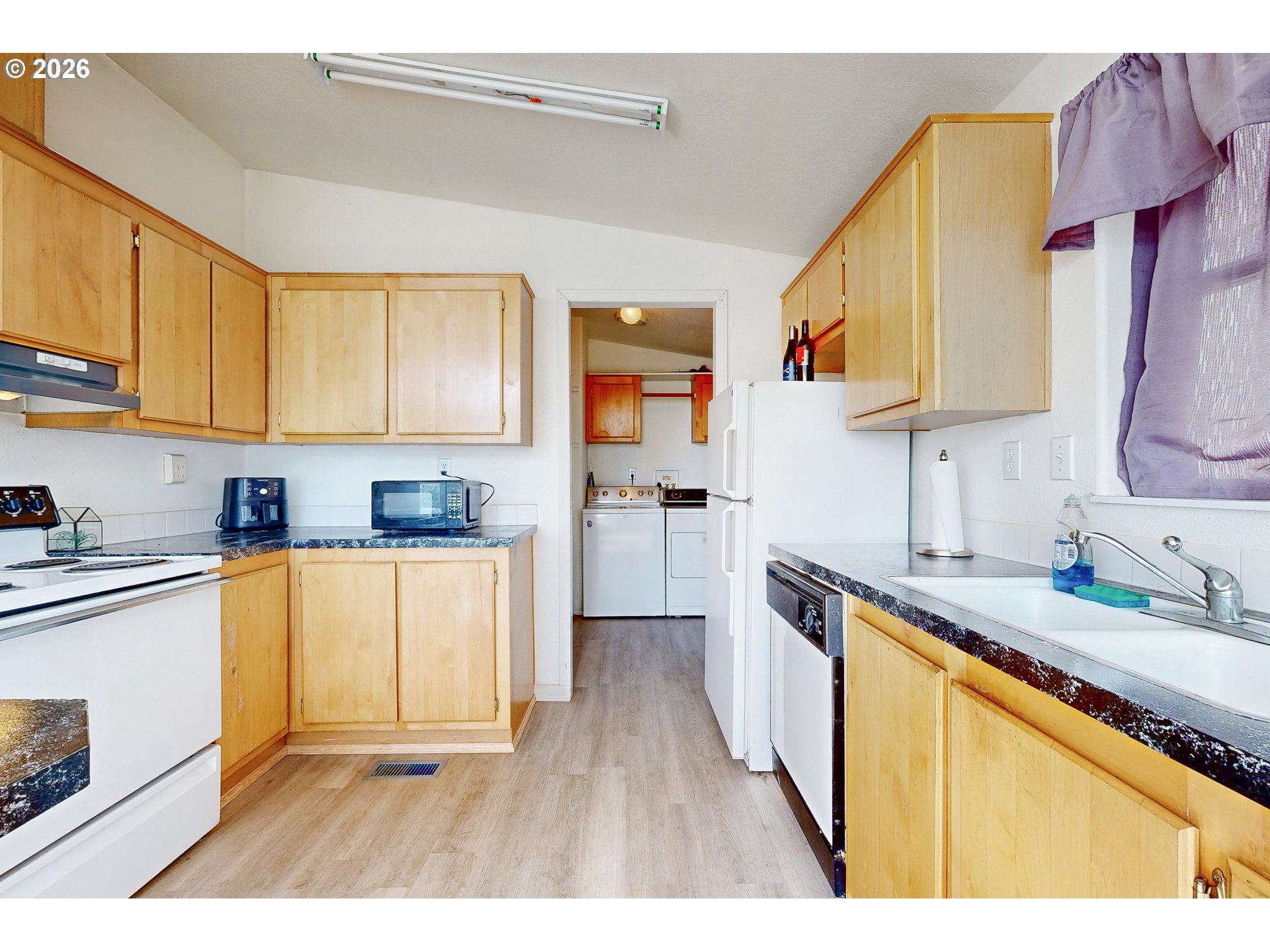 84889 Triangle Station Road Milton Freewater, OR 97862 - Photo 12 of 40 a kitchen with stainless steel appliances granite countertop a sink stove and cabinets