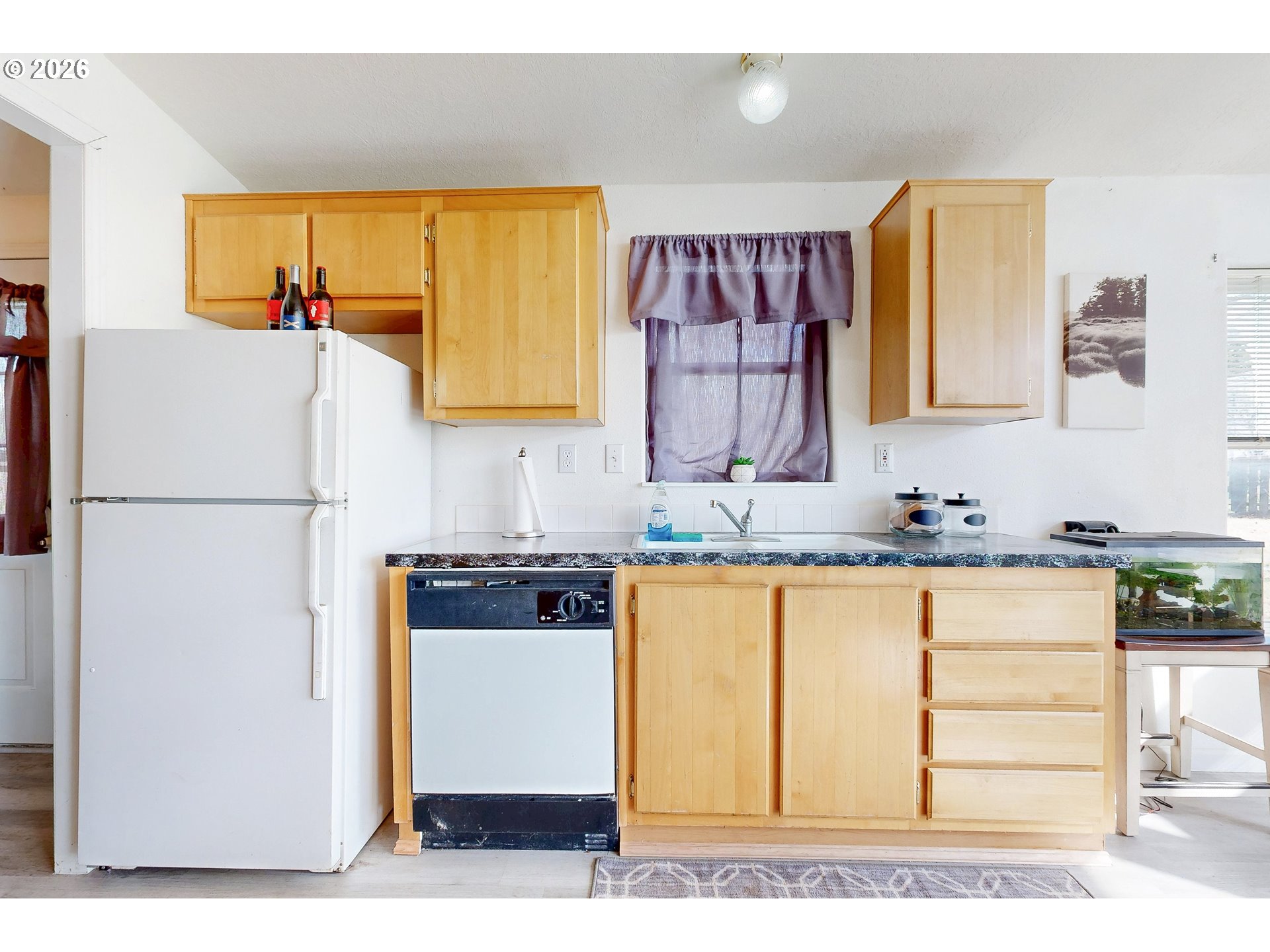 84889 Triangle Station Road Milton Freewater, OR 97862 - Photo 13 of 40 a kitchen with stainless steel appliances granite countertop a refrigerator sink stove and granite counter top