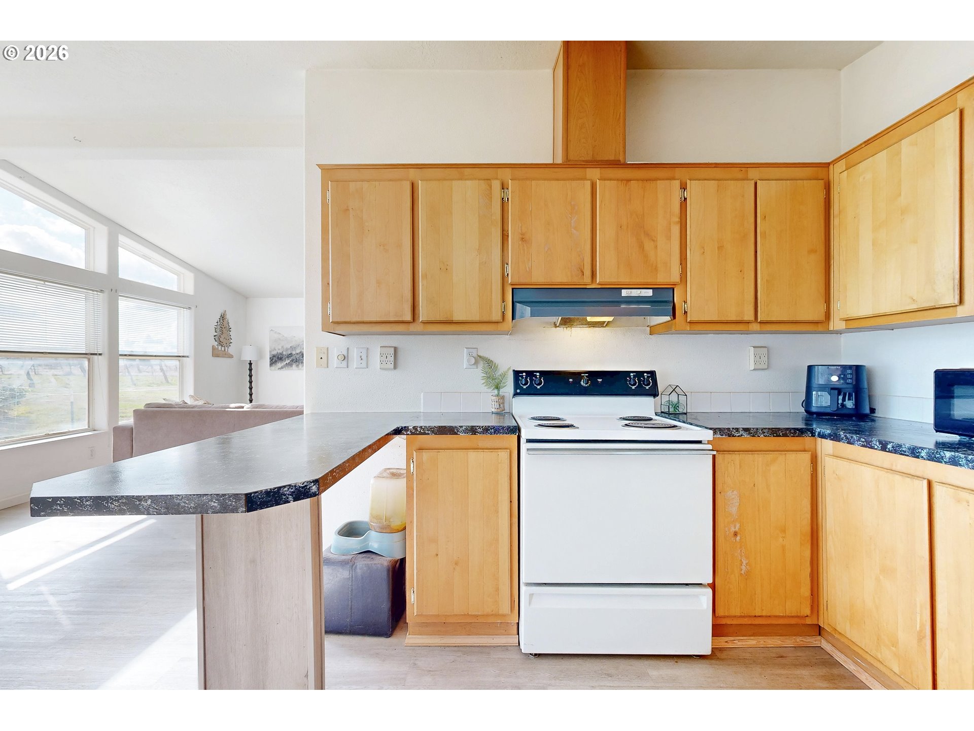 84889 Triangle Station Road Milton Freewater, OR 97862 - Photo 14 of 40 a kitchen with stainless steel appliances granite countertop a sink a stove and a microwave