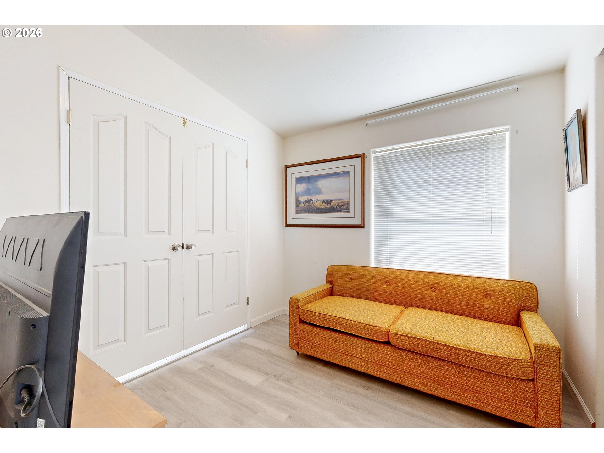 84889 Triangle Station Road Milton Freewater, OR 97862 - Photo 17 of 40 a blue couch sitting in a living room with a couch