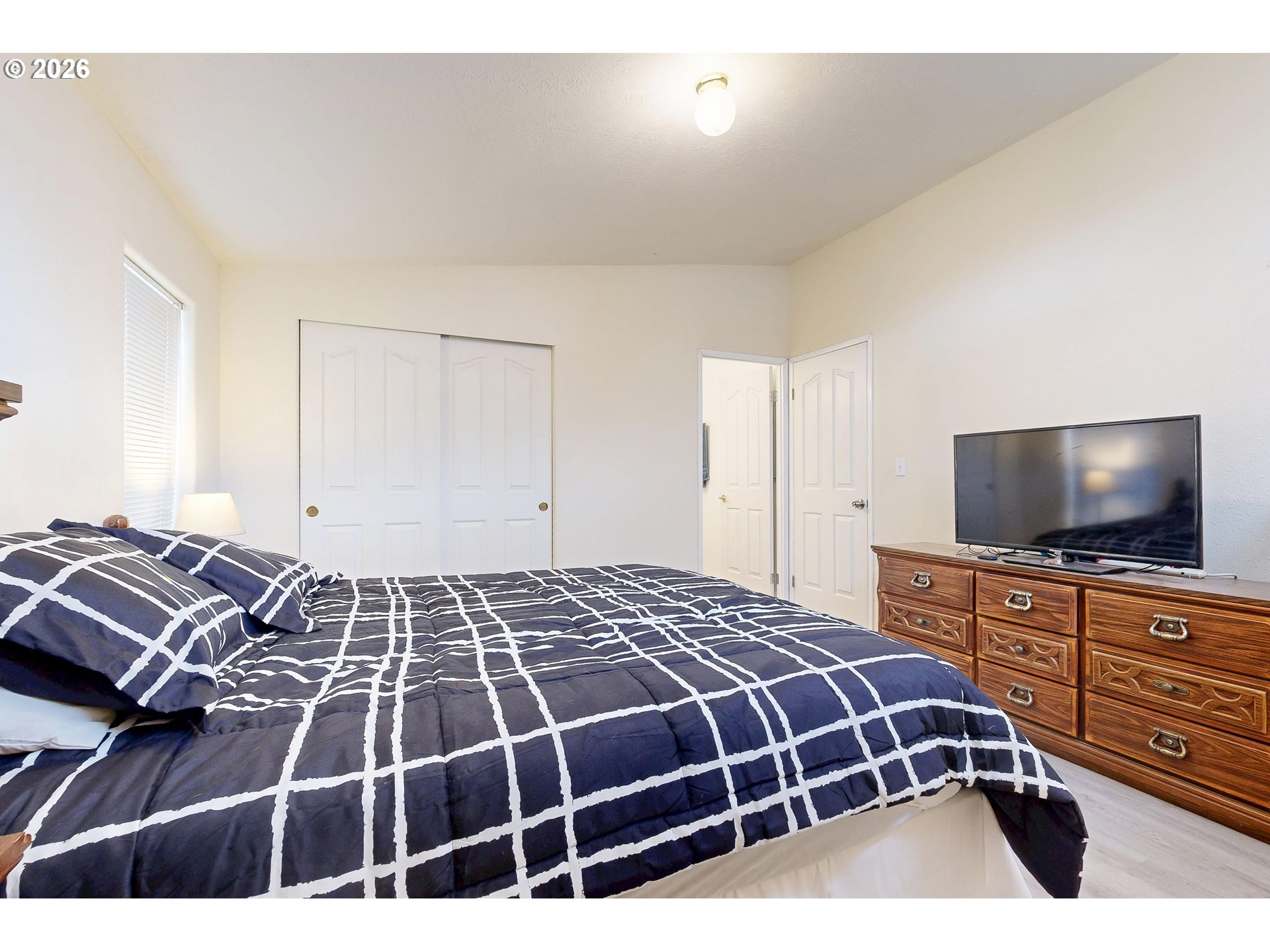 84889 Triangle Station Road Milton Freewater, OR 97862 - Photo 22 of 40 a bedroom with a bed and flat screen tv