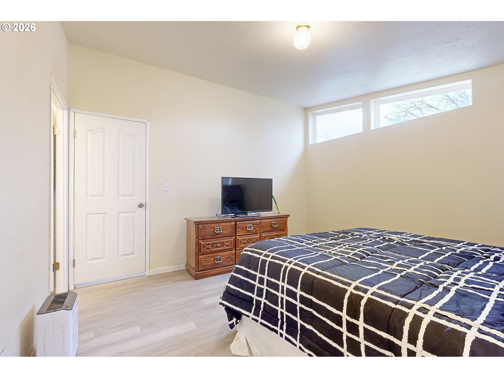 84889 Triangle Station Road Milton Freewater, OR 97862 - Photo 23 of 40 a bedroom with a bed and flat screen tv