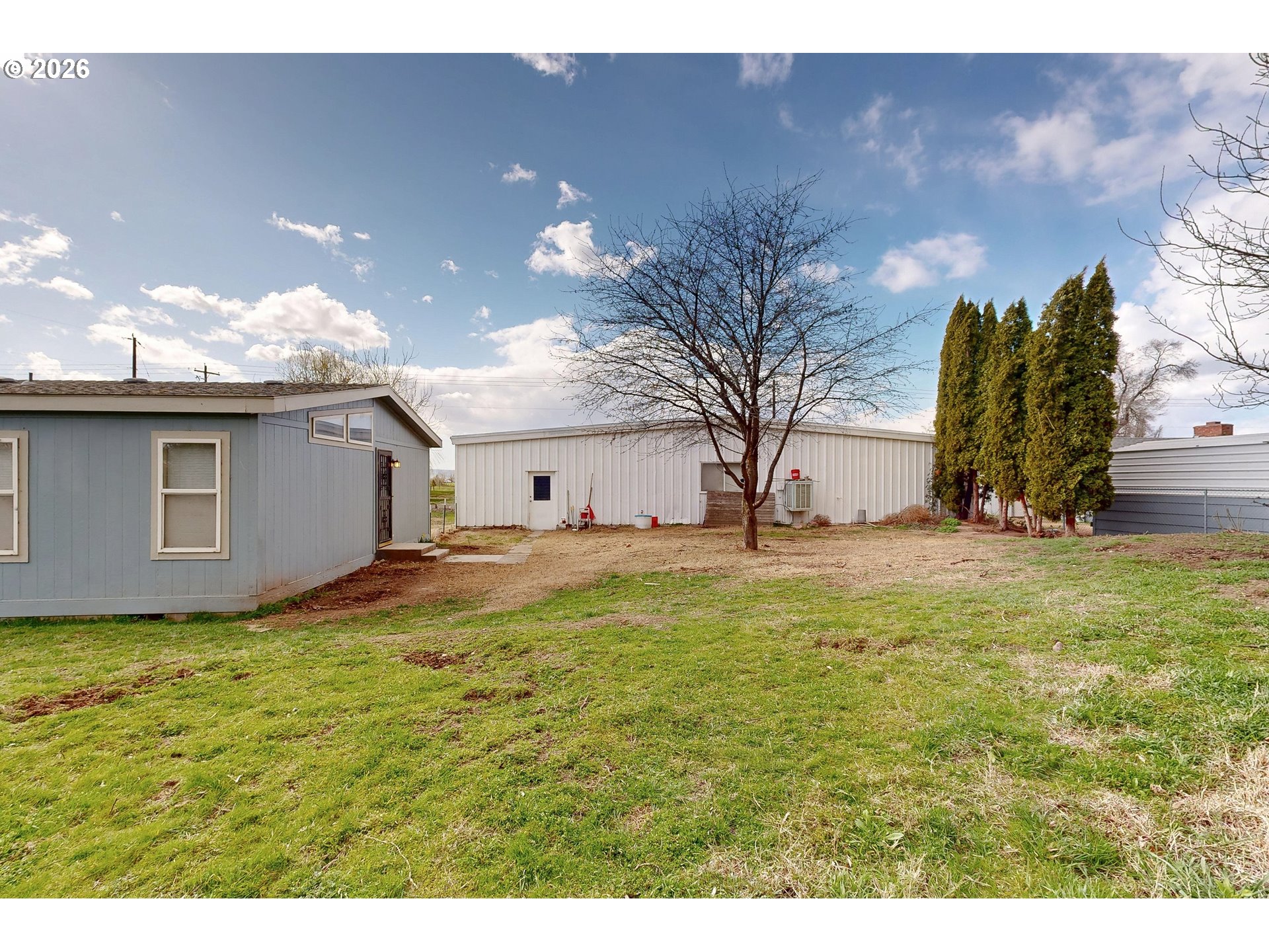 84889 Triangle Station Road Milton Freewater, OR 97862 - Photo 28 of 40 a view of a yard with a house