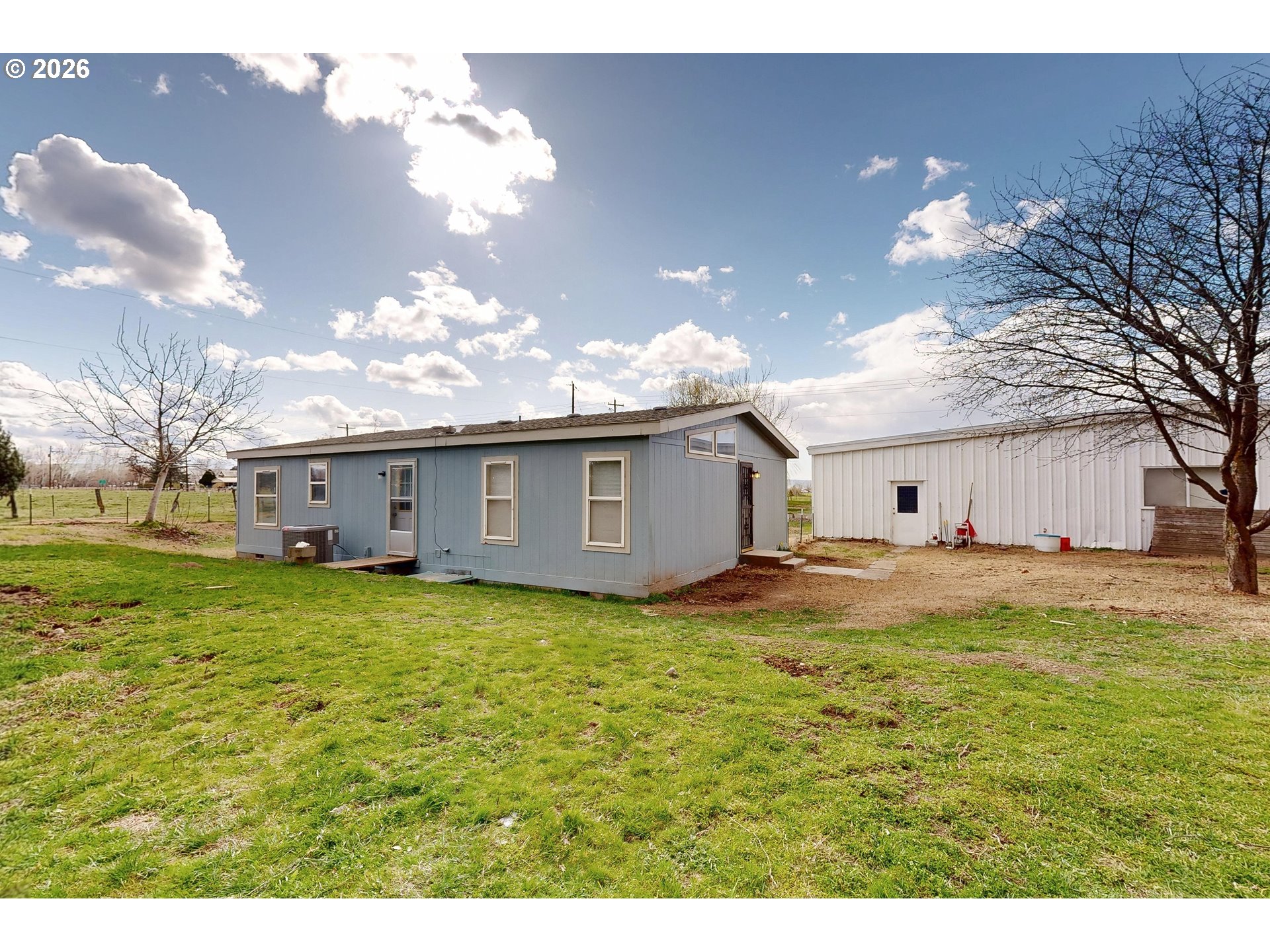 84889 Triangle Station Road Milton Freewater, OR 97862 - Photo 29 of 40 a view of a house with a big yard