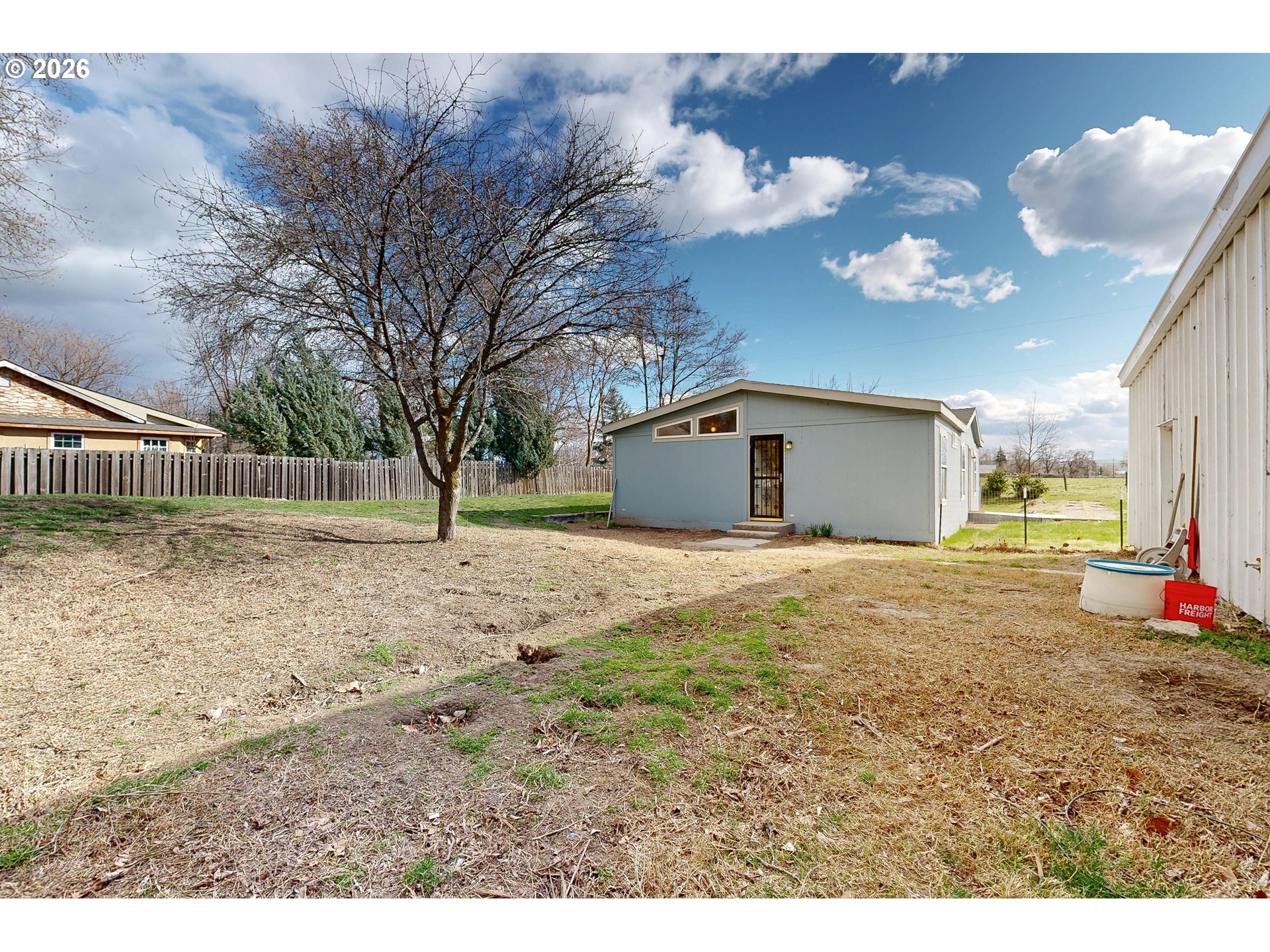 84889 Triangle Station Road Milton Freewater, OR 97862 - Photo 31 of 40 a view of a house with a backyard