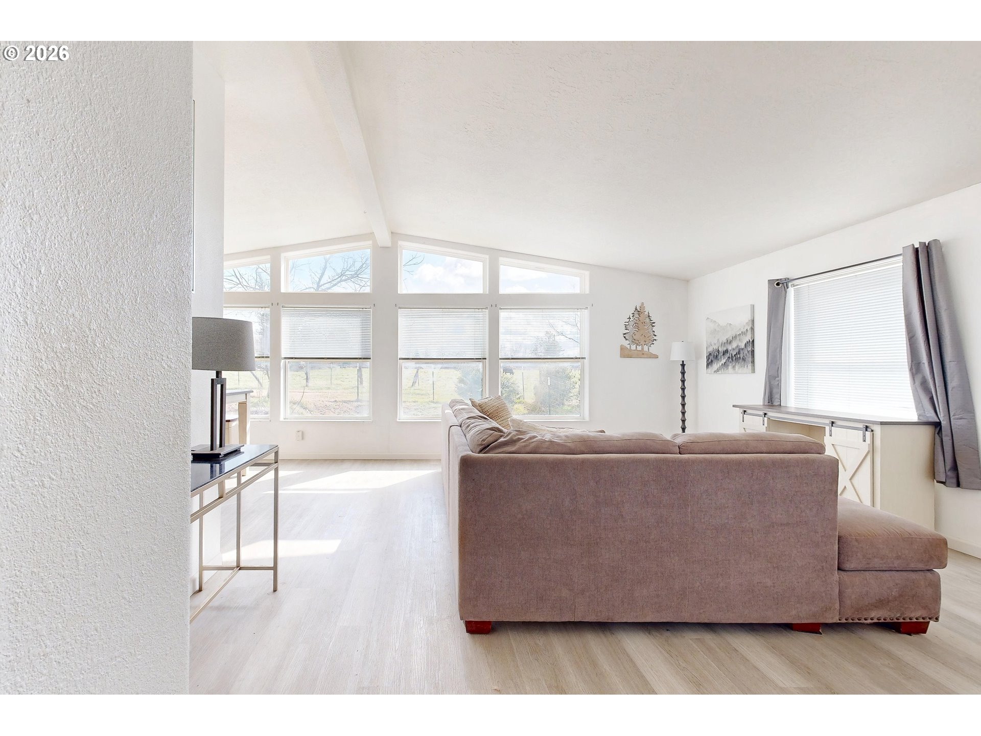84889 Triangle Station Road Milton Freewater, OR 97862 - Photo 4 of 40 a living room with a couch and a table