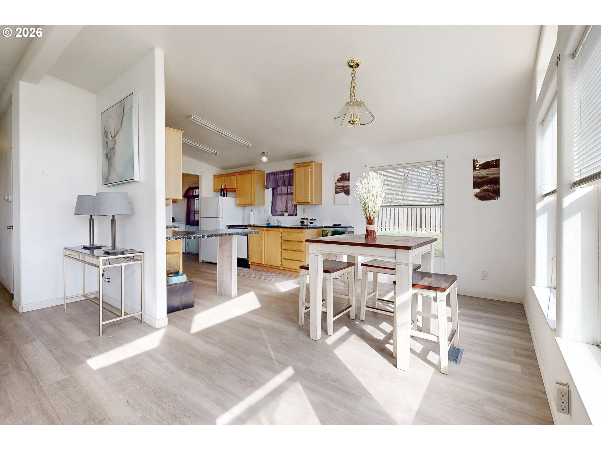 84889 Triangle Station Road Milton Freewater, OR 97862 - Photo 5 of 40 a living room with stainless steel appliances kitchen island granite countertop furniture and a dining table