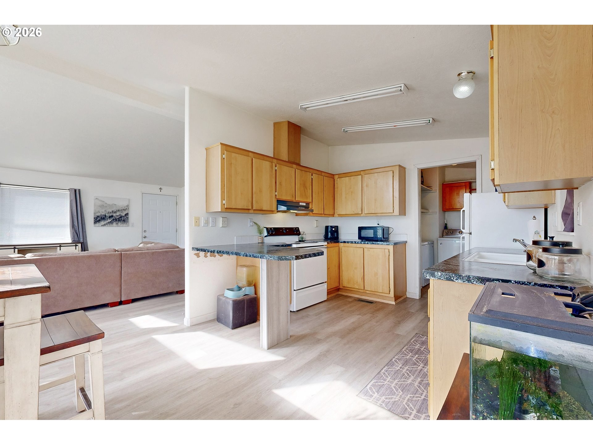 84889 Triangle Station Road Milton Freewater, OR 97862 - Photo 10 of 40 a kitchen with stainless steel appliances kitchen island granite countertop a sink and cabinets