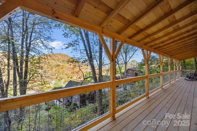 a view of balcony with wooden floor