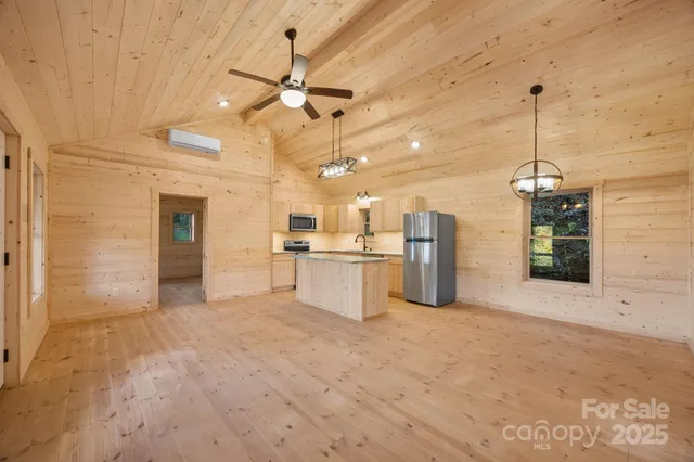 a view of a kitchen with a sink and cabinet area