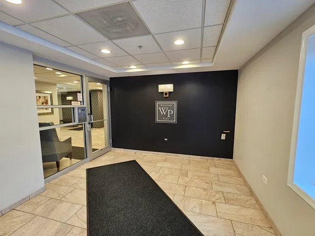 a kitchen with a table chairs a sink dishwasher stove and cabinets with wooden floor