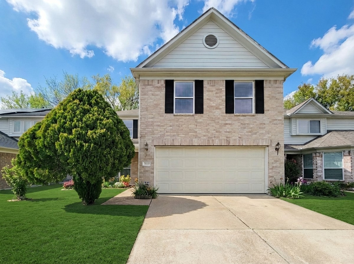 3602 Zephyr Glen Way Houston, TX 77084 - Photo 1 of 42 a front view of a house with a garden