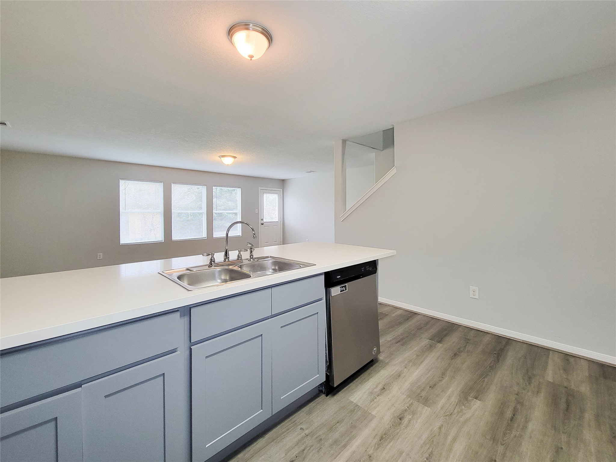3602 Zephyr Glen Way Houston, TX 77084 - Photo 11 of 42 a kitchen with a sink cabinets and wooden floor