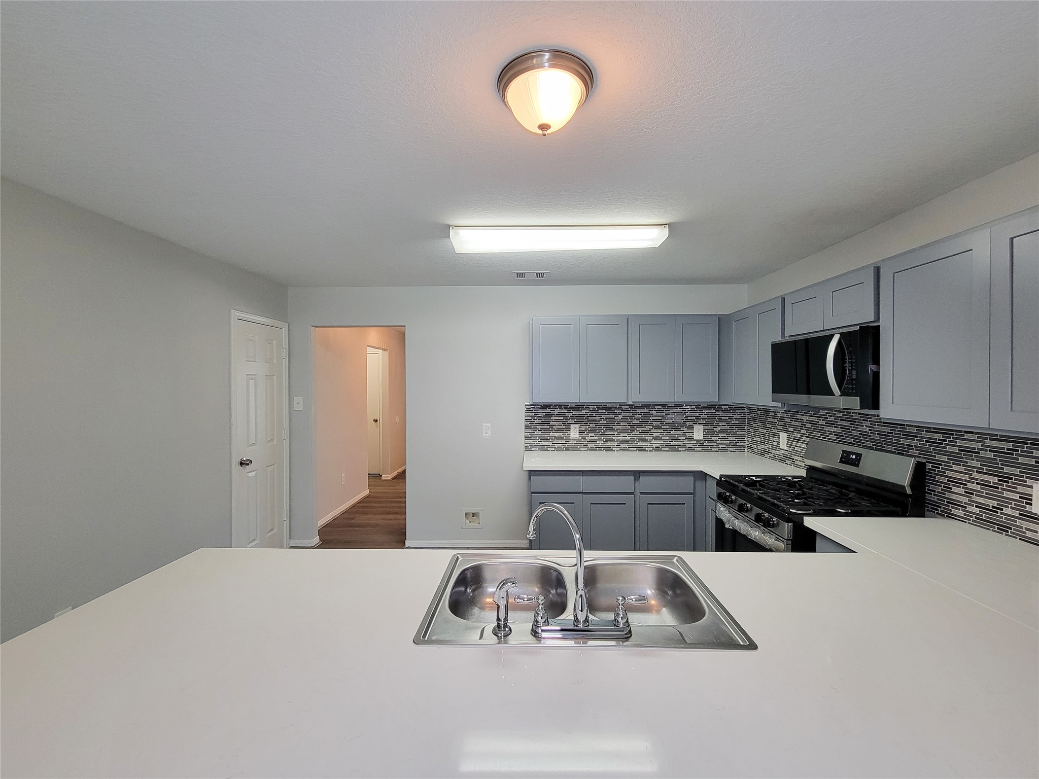 3602 Zephyr Glen Way Houston, TX 77084 - Photo 12 of 42 a kitchen that has a lot of cabinets in it