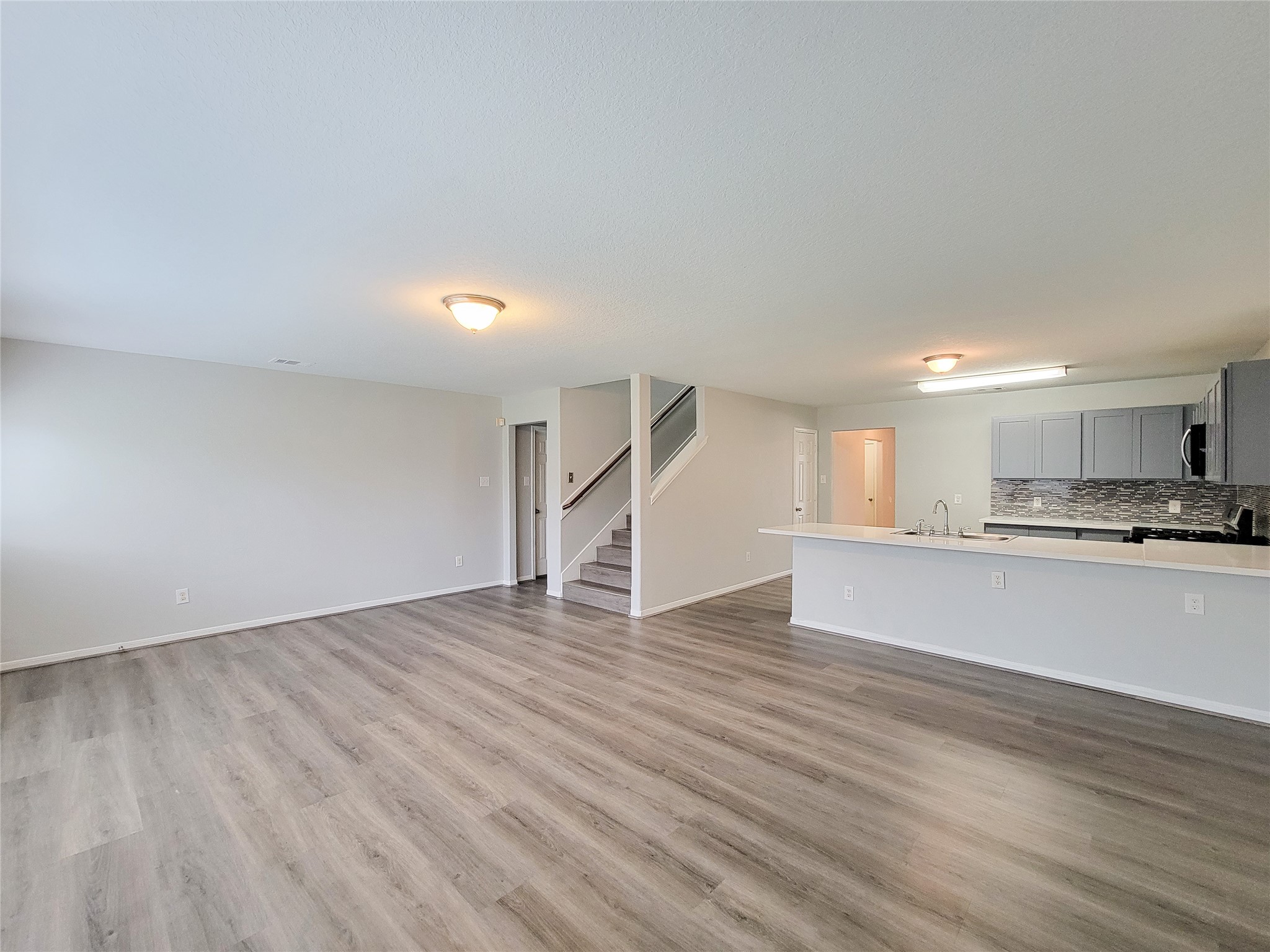 3602 Zephyr Glen Way Houston, TX 77084 - Photo 15 of 42 a view of a kitchen with wooden floor and a sink
