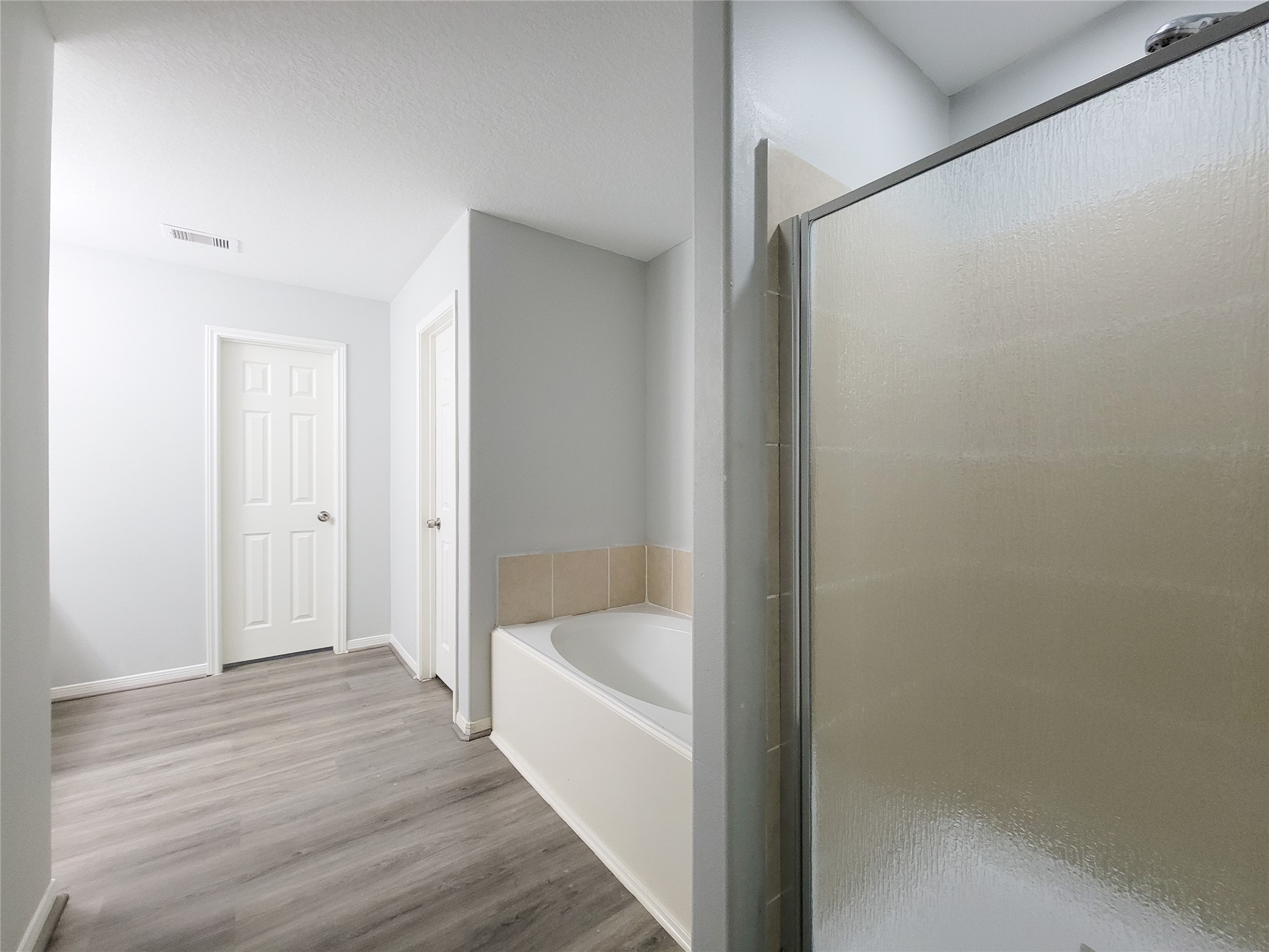 3602 Zephyr Glen Way Houston, TX 77084 - Photo 21 of 42 a bathroom with a bathtub and shower