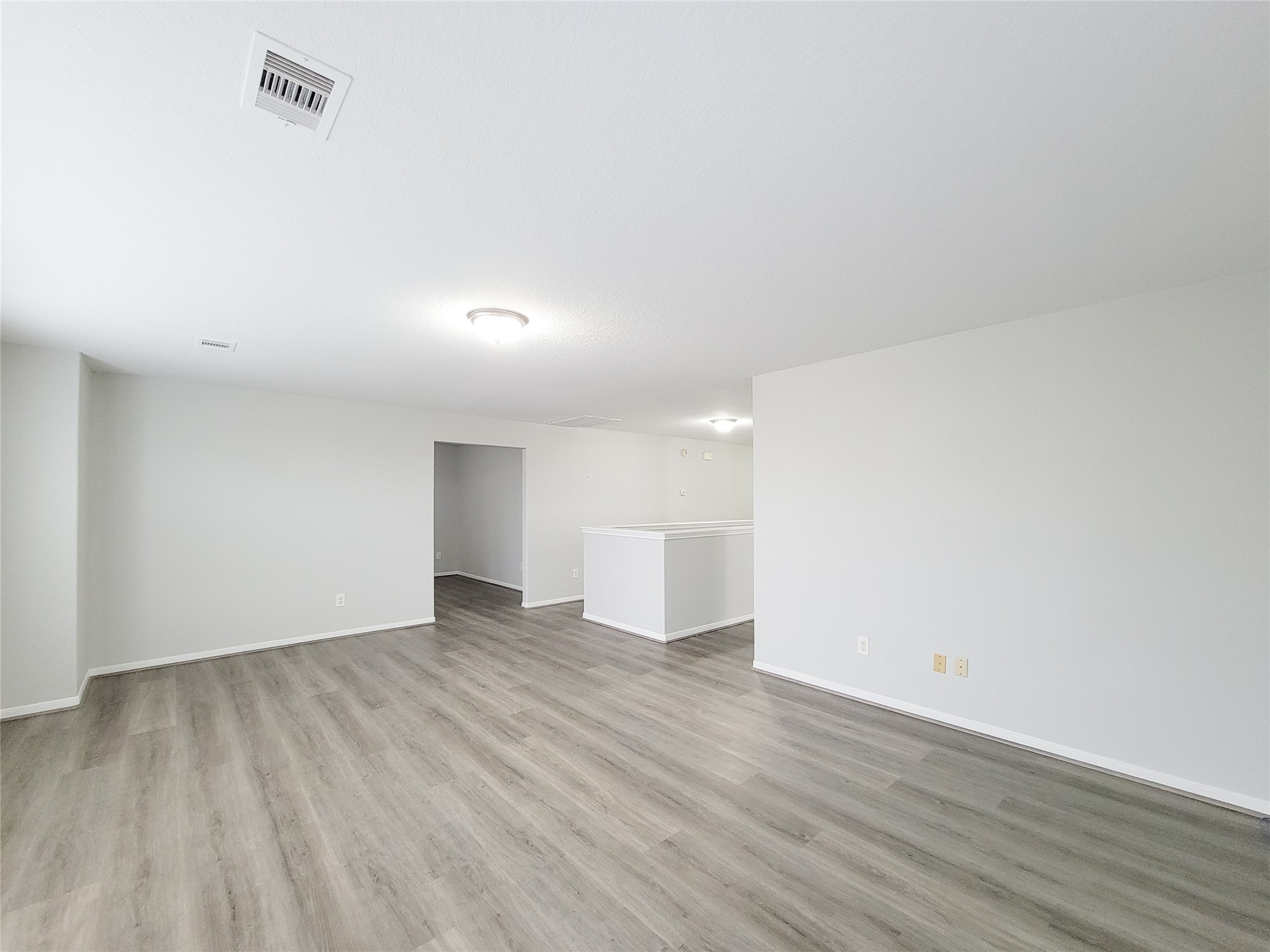 3602 Zephyr Glen Way Houston, TX 77084 - Photo 29 of 42 a view of an empty room with wooden floor and a window