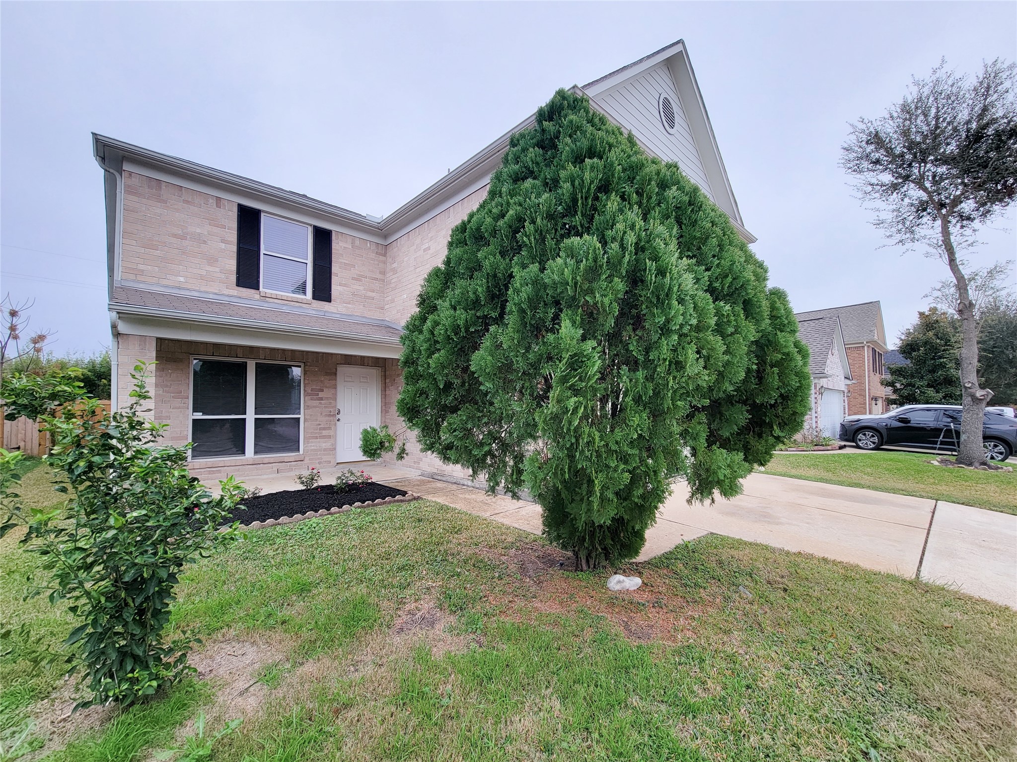 3602 Zephyr Glen Way Houston, TX 77084 - Photo 3 of 42 a front view of a house with a yard and trees