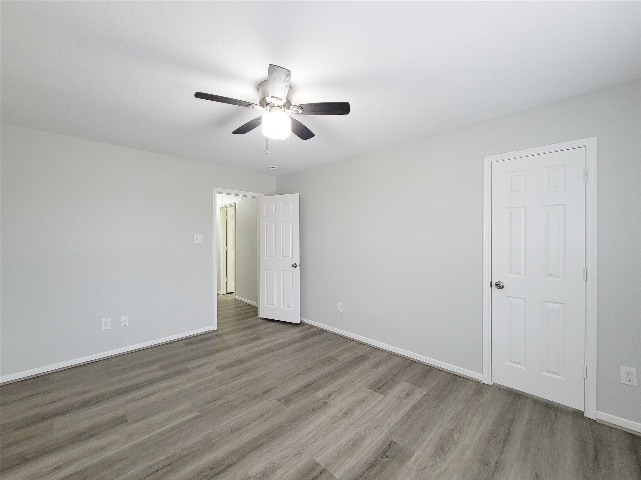 3602 Zephyr Glen Way Houston, TX 77084 - Photo 35 of 42 a view of an empty room with wooden floor