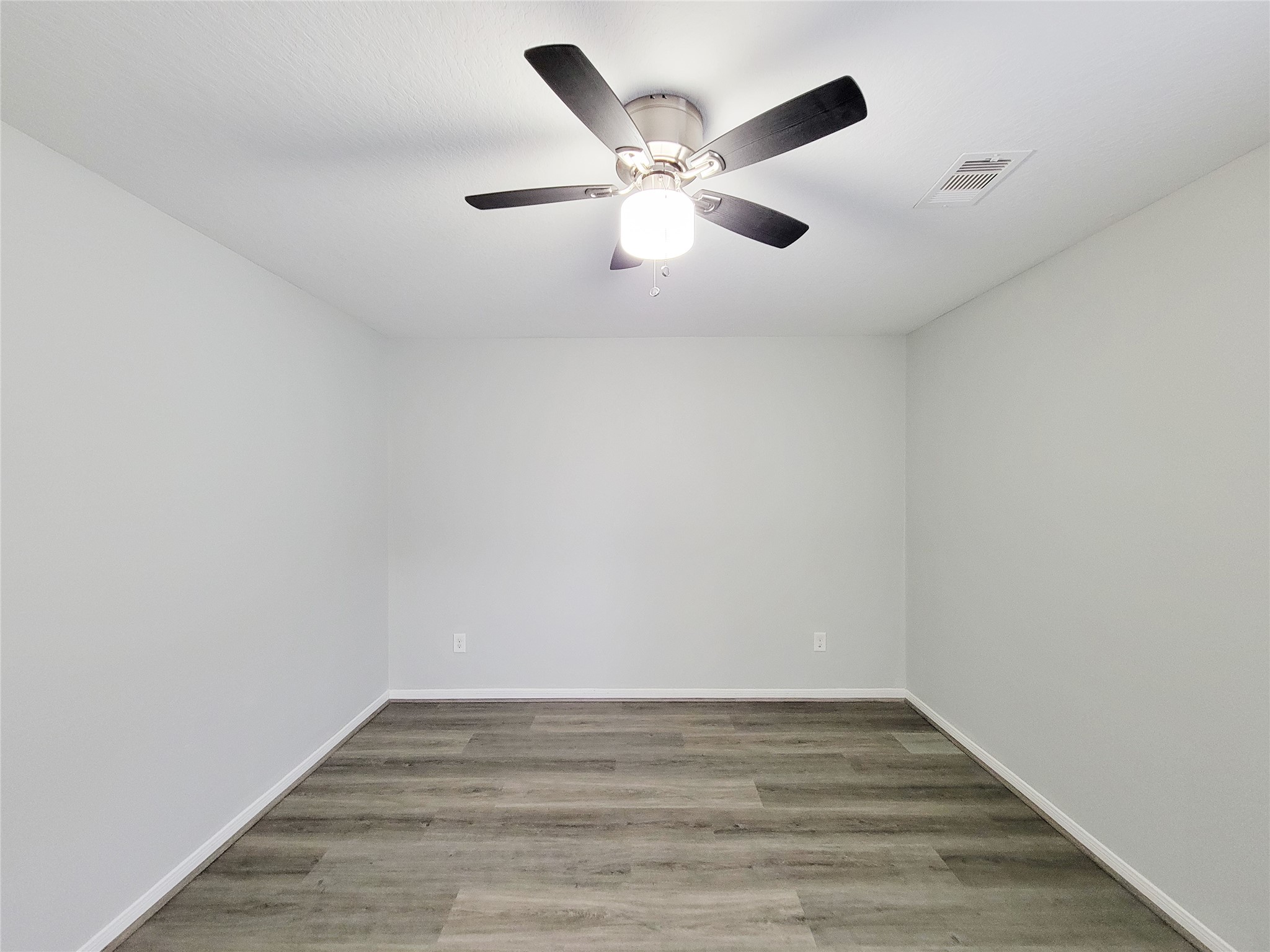 3602 Zephyr Glen Way Houston, TX 77084 - Photo 38 of 42 a view of an empty room with wooden floor