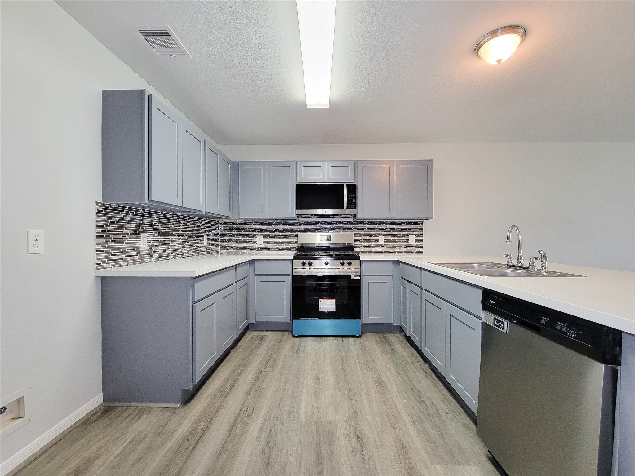 3602 Zephyr Glen Way Houston, TX 77084 - Photo 8 of 42 a kitchen with stainless steel appliances granite countertop a stove sink and cabinets