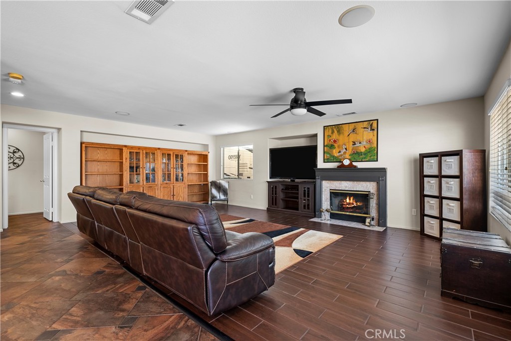 32810 The Old Road Castaic, CA 91384 - Photo 13 of 45 a living room with furniture a fireplace and a flat screen tv