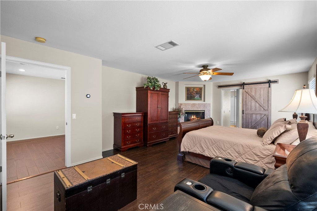 32810 The Old Road Castaic, CA 91384 - Photo 23 of 45 a bedroom with a bed and wooden floor
