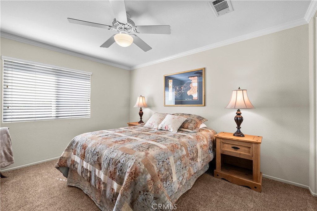 32810 The Old Road Castaic, CA 91384 - Photo 31 of 45 a bedroom with a bed and a chandelier