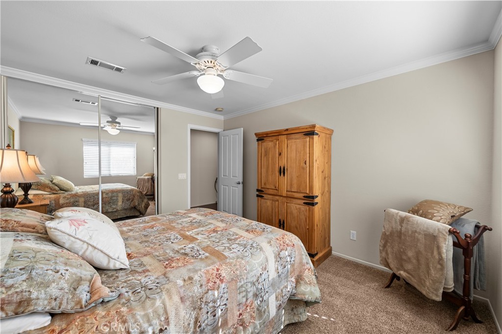 32810 The Old Road Castaic, CA 91384 - Photo 32 of 45 a bedroom with a bed and a chandelier