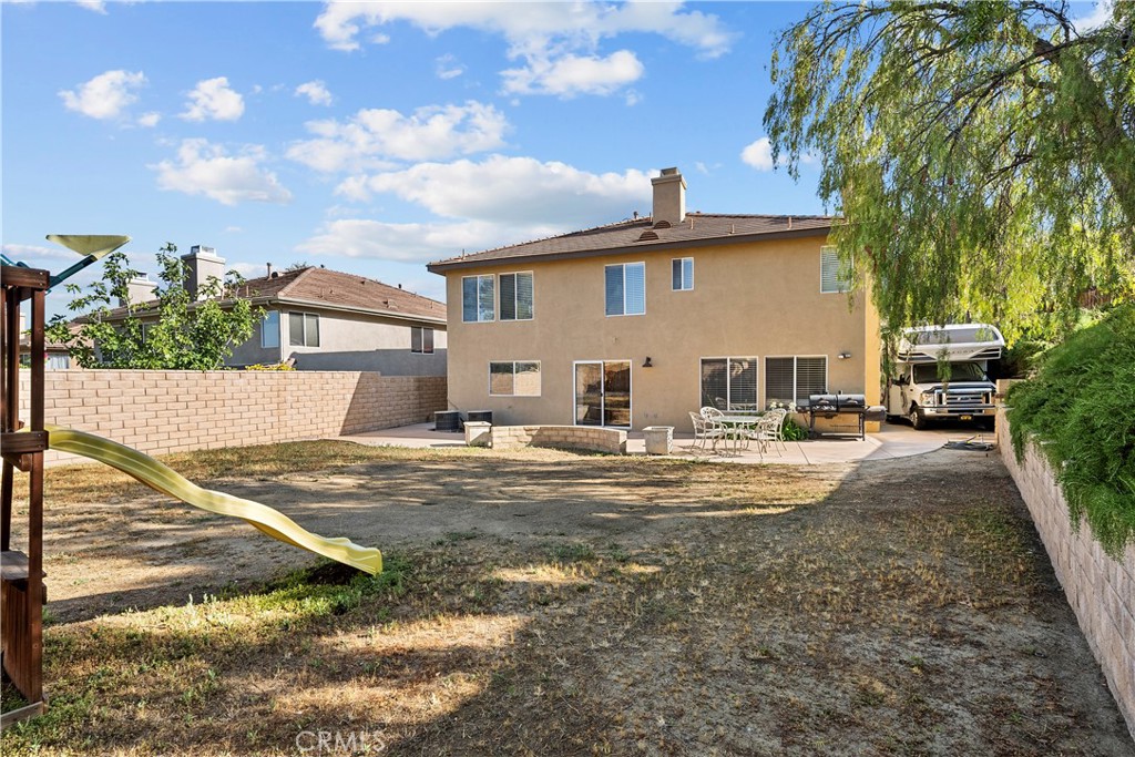32810 The Old Road Castaic, CA 91384 - Photo 41 of 45 a view of a white house with a yard