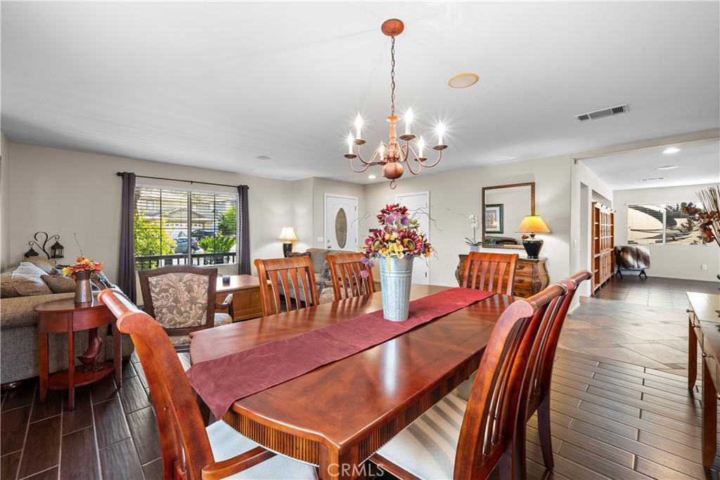 32810 The Old Road Castaic, CA 91384 - Photo 8 of 45 a view of a dining room with furniture wooden floor and chandelier