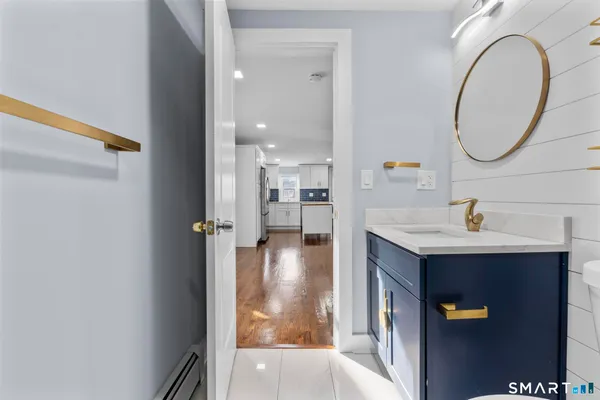 a view of a bathroom from a hallway