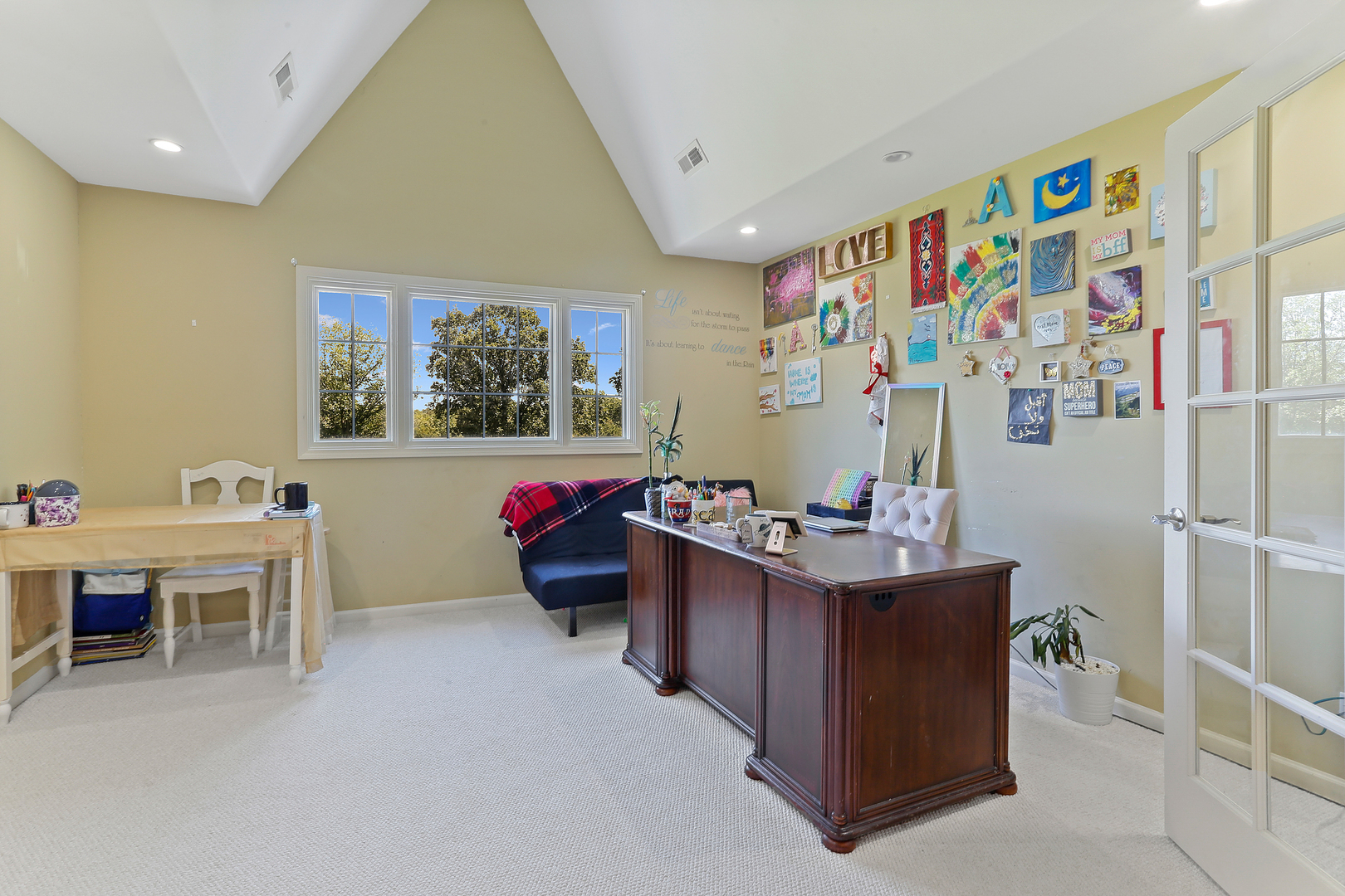54 Sawgrass Drive Lemont, IL 60439 - Photo 18 of 41 a living room with furniture and paintings on the wall