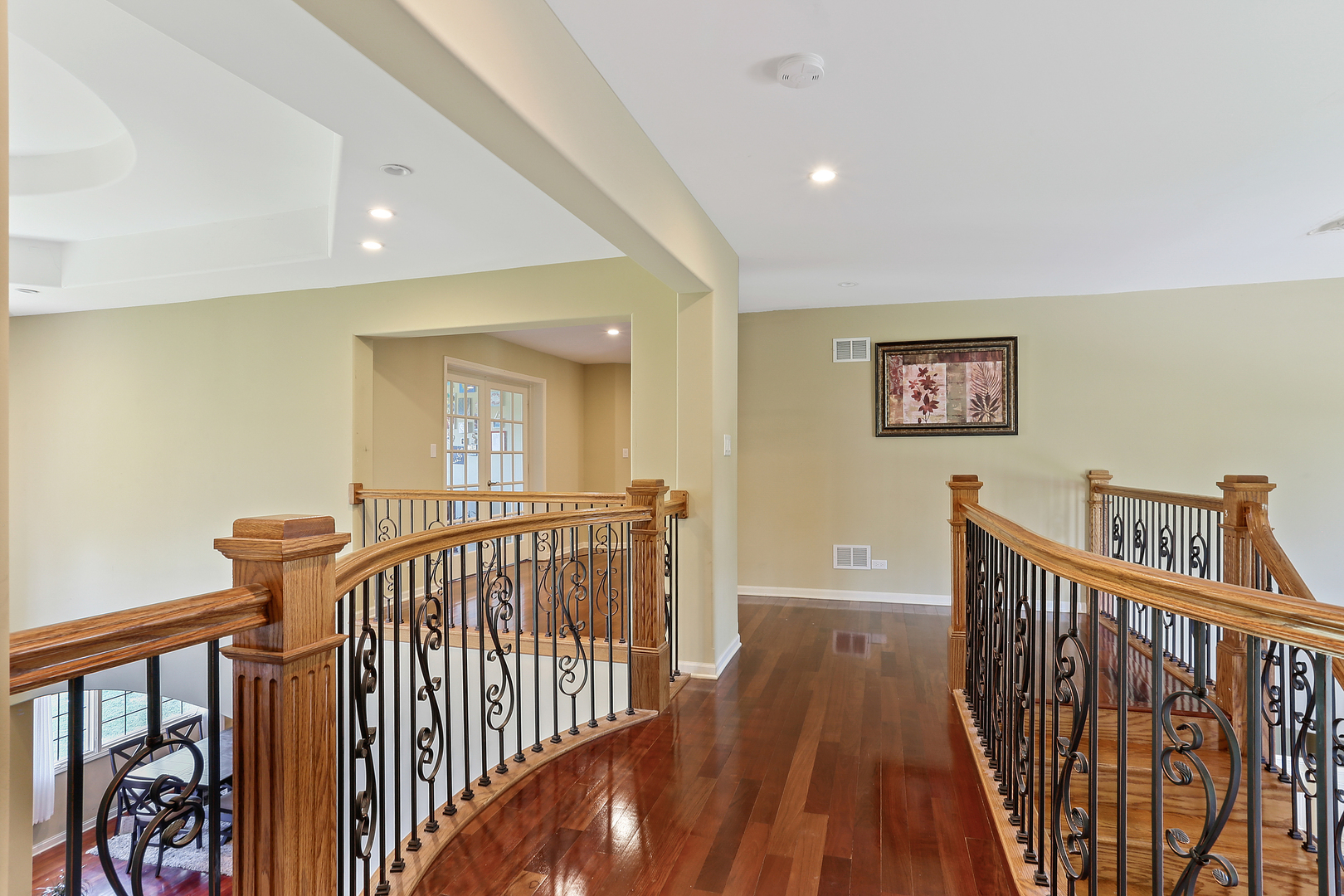 54 Sawgrass Drive Lemont, IL 60439 - Photo 23 of 41 a view of a hallway with wooden floor and stairs
