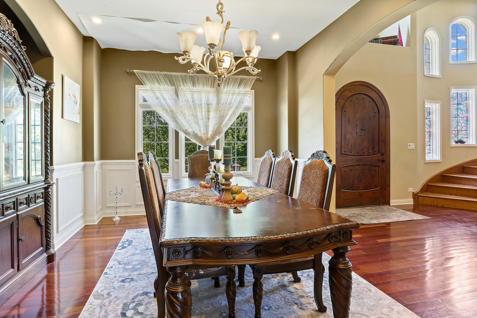 54 Sawgrass Drive Lemont, IL 60439 - Photo 4 of 41 a view of a dining room with furniture wooden floor and chandelier