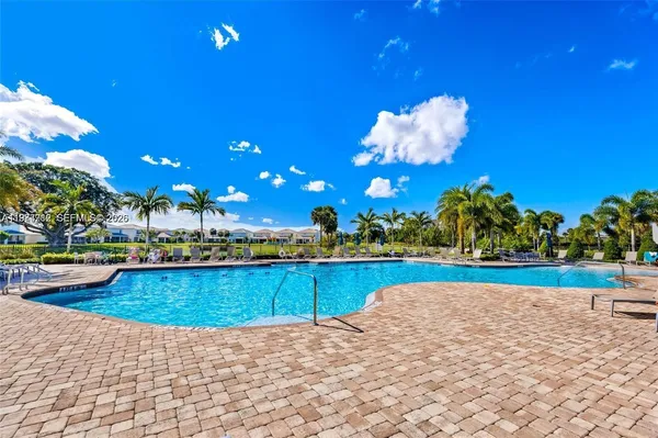 a view of a swimming pool and an outdoor space