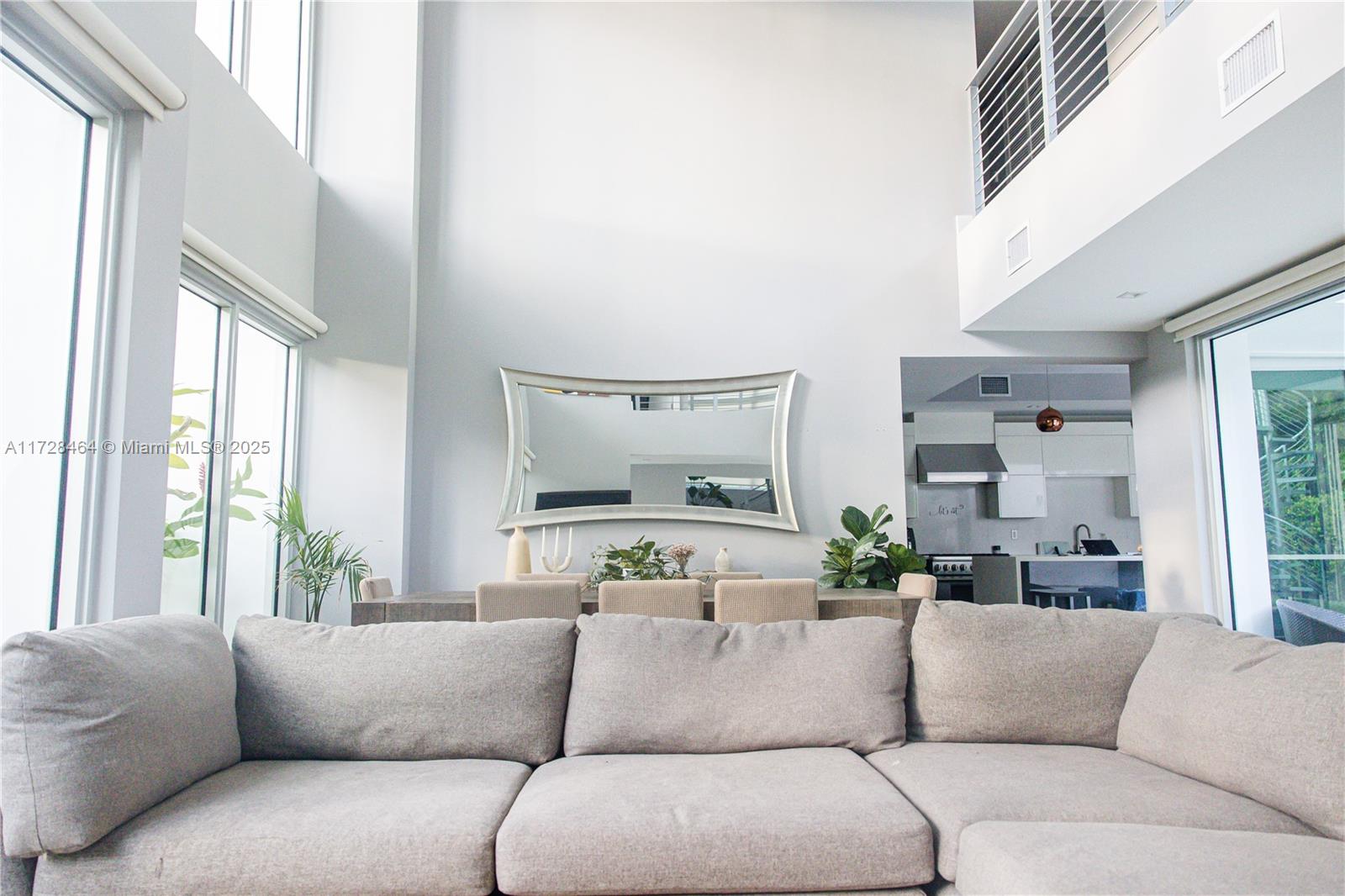 6790 Southwest 72nd Street South Miami, FL 33143 - Photo 26 of 34 a living room with furniture and a large window