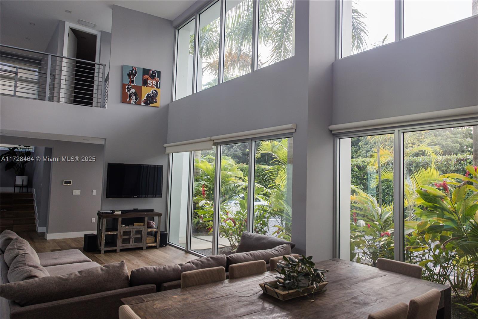 6790 Southwest 72nd Street South Miami, FL 33143 - Photo 28 of 34 a living room with furniture and a flat screen tv