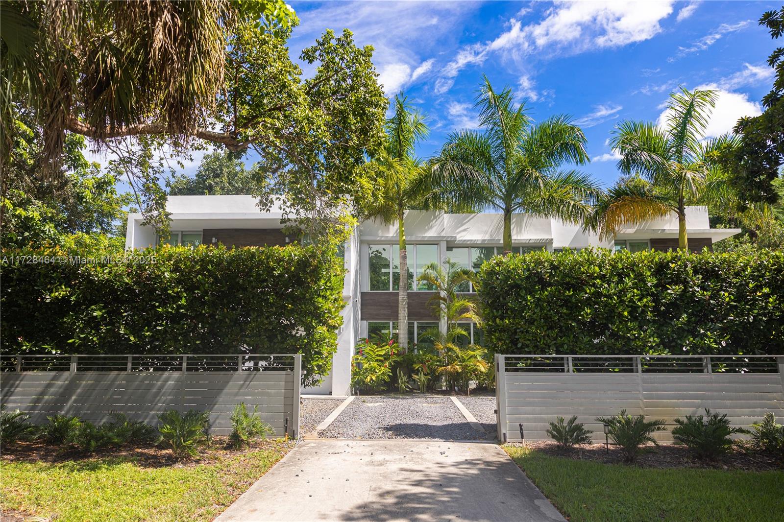 6790 Southwest 72nd Street South Miami, FL 33143 - Photo 4 of 34 a view of a fountain in front of a house