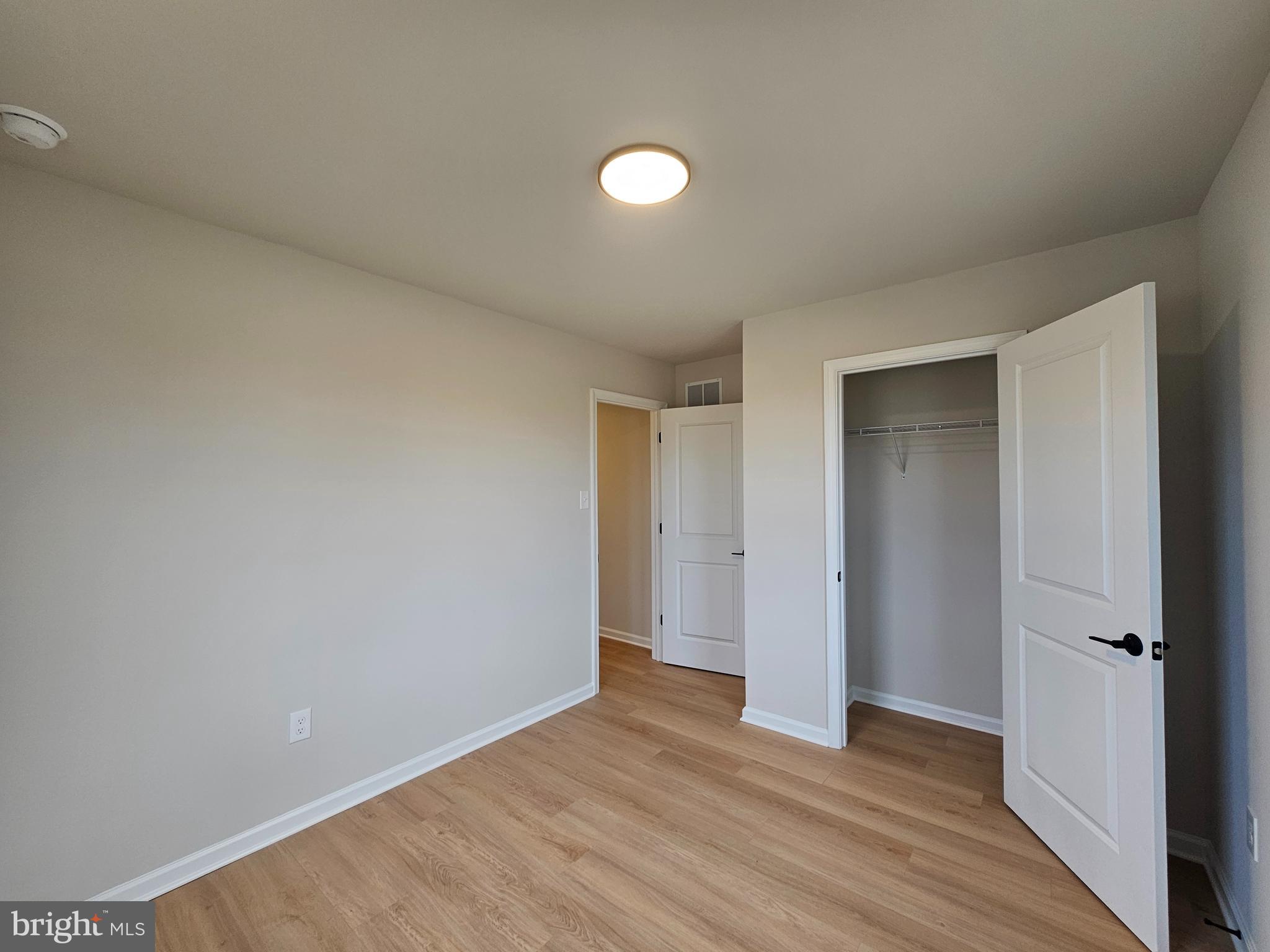 16 Field Stone Court Bridgeton, NJ 08302 - Photo 11 of 20 a view of an empty room with wooden floor and closet