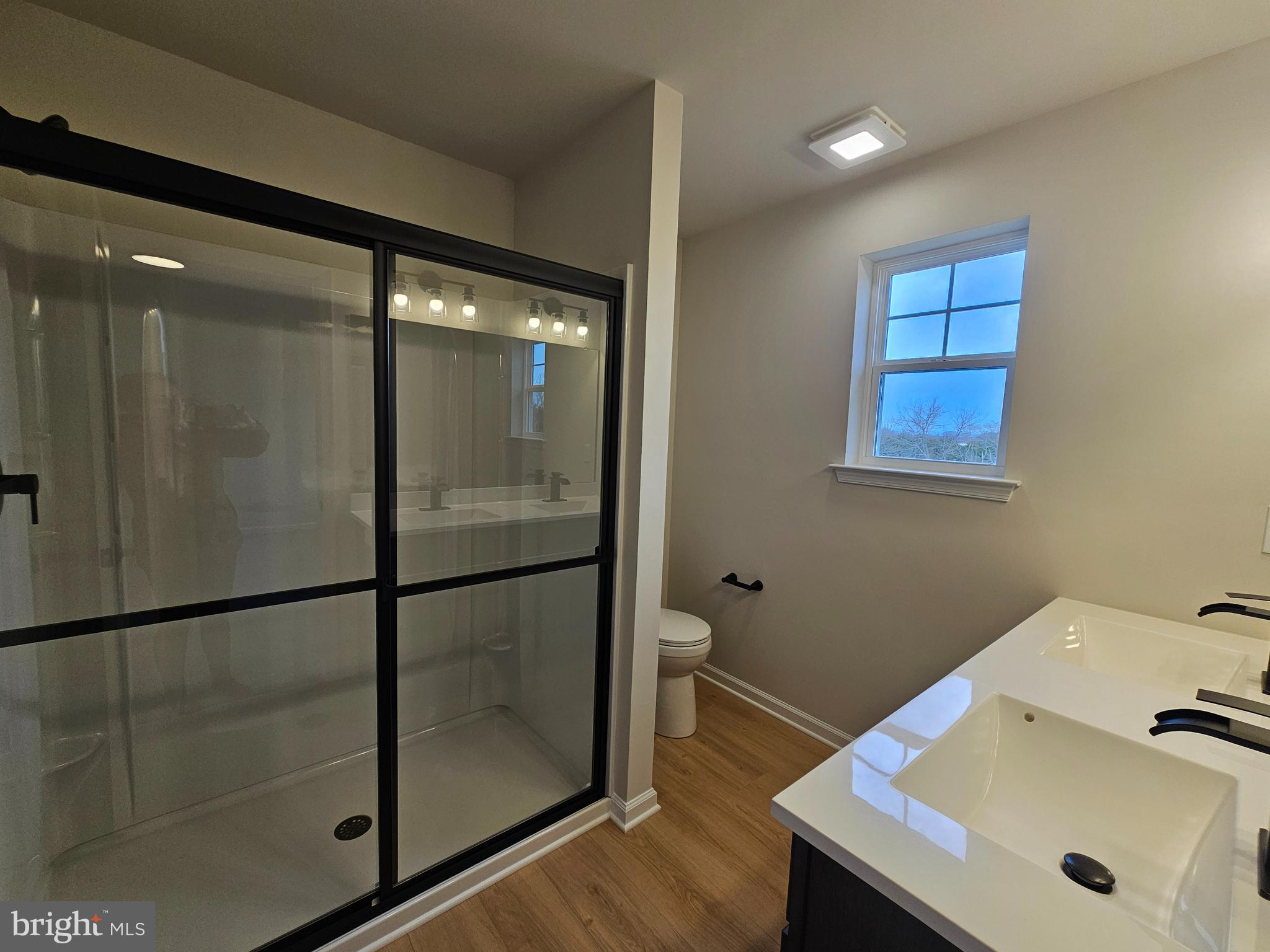 16 Field Stone Court Bridgeton, NJ 08302 - Photo 15 of 20 a bathroom with a sink and glass door